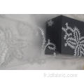 Tissu en maille 100% nylon blanc avec paillettes